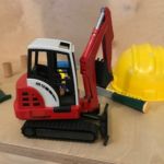 Repaired toy excavator