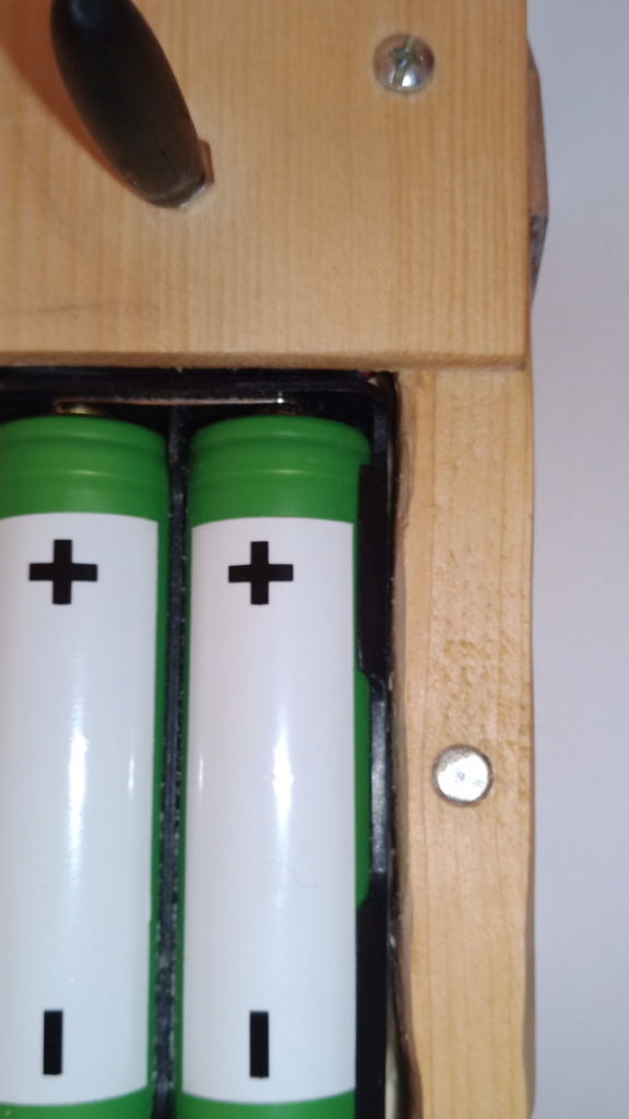 Magnetic closure battery compartment