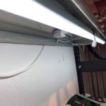 Under cabinet light with light sensor