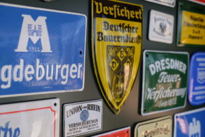 Detailed view of enamel signs in a showcase