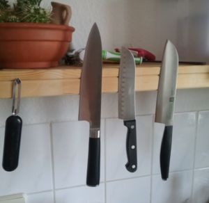 Kitchen shelf knife holder